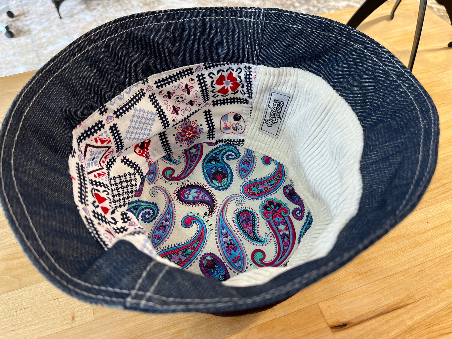 reversible black laced corduroy bucket hat / short brim